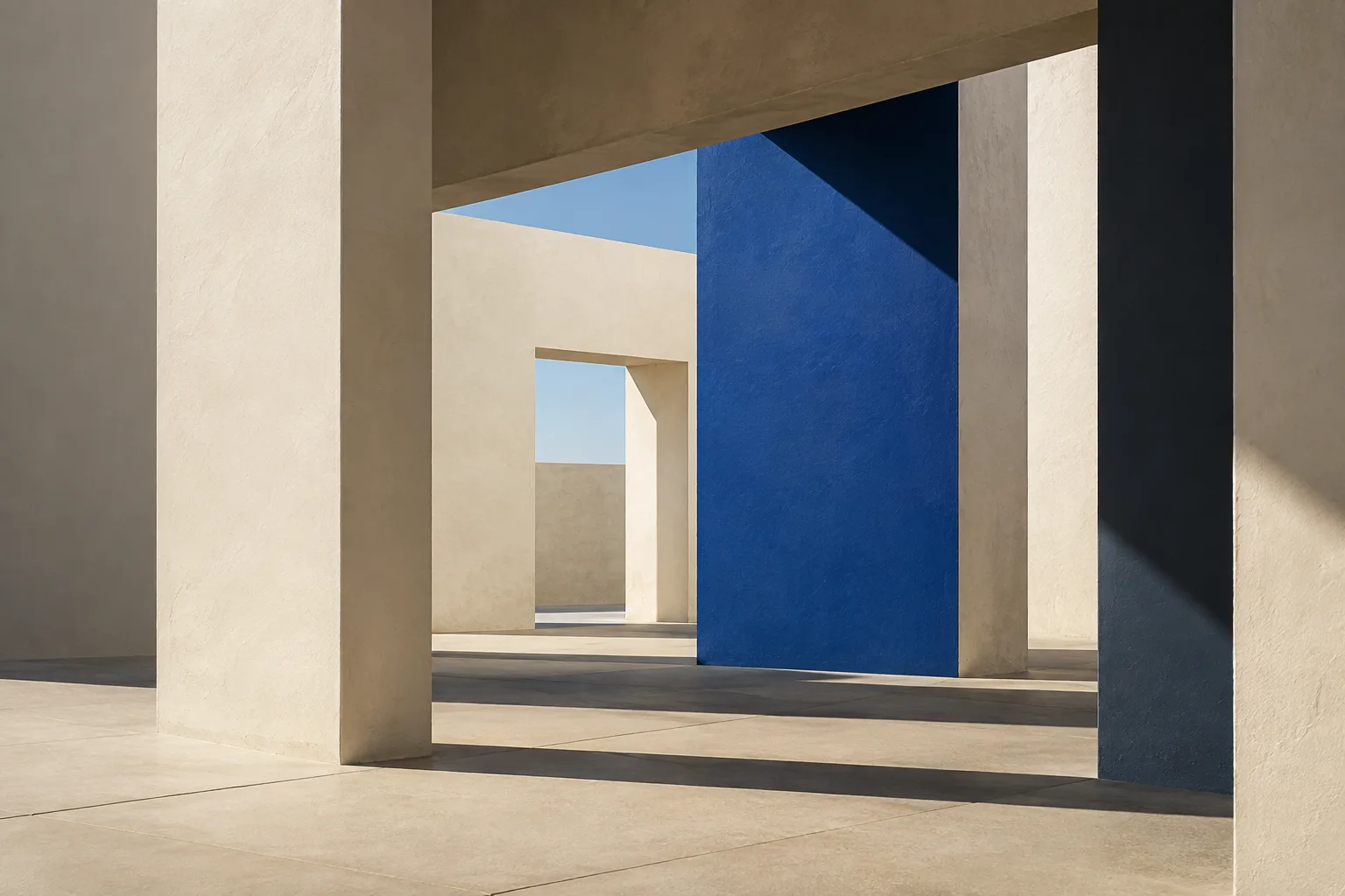 Sunlit ivory architectural spaces connected by a vivid blue plane